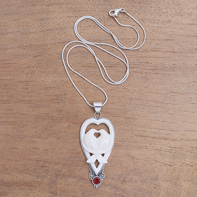 Garnet and bone pendant necklace, 'Dove Couple' - Garnet and Bone Dove Pendant Necklace from Bali