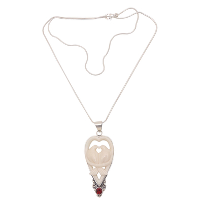 Garnet and bone pendant necklace, 'Dove Couple' - Garnet and Bone Dove Pendant Necklace from Bali