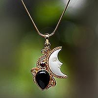 Gold plated onyx and garnet pendant necklace, 'Crescent Mystery' - Gold Plated Onyx and Garnet Pendant Necklace from Bali