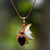 Gold plated onyx and garnet pendant necklace, 'Crescent Mystery' - Gold Plated Onyx and Garnet Pendant Necklace from Bali (image 2) thumbail