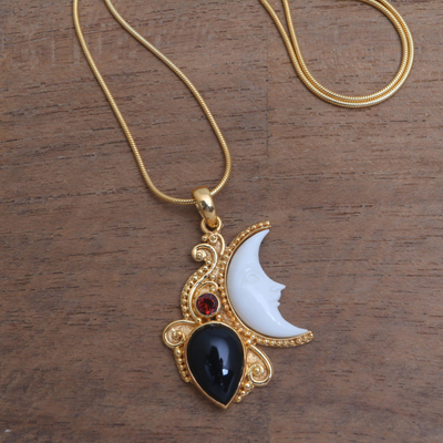 Gold plated onyx and garnet pendant necklace, 'Crescent Mystery' - Gold Plated Onyx and Garnet Pendant Necklace from Bali