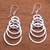 Sterling silver dangle earrings, 'Shimmering Moons' - 925 Sterling Silver Dangle Earrings with Circle Pattern