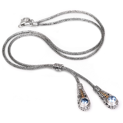 Gold accent blue topaz lariat necklace, 'Twin Sparkle' - Gold Accented Blue Topaz Lariat Necklace from Bali