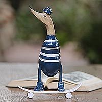 Featured review for Wood and bamboo root sculpture, Skateboard Duck