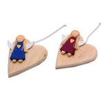 Wood ornaments, 'Heart of Angels' (pair) - Heart-Shaped Albesia Wood Angel Ornaments from Bali (Pair)