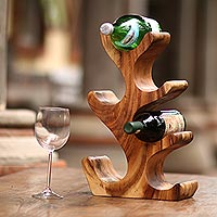 Wood wine holder, 'Bottle Tree' - Hand-Carved Suar Wood Wine Holder for 6 from Bali