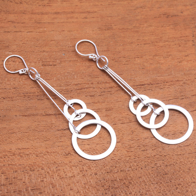 Sterling silver dangle earrings, 'Ring Triplets' - Circle Motif Sterling Silver Dangle Earrings from Bali