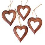 Wood ornaments, 'Heart Grain' (set of 4) - Heart-Shaped Suar Wood Ornaments from Bali (Set of 4)