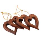 Wood ornaments, 'Heart Grain' (set of 4) - Heart-Shaped Suar Wood Ornaments from Bali (Set of 4)