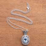 Blue topaz pendant necklace, 'Angel Eye' - Swirl Pattern Blue Topaz Pendant Necklace from Bali