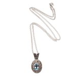Blue topaz pendant necklace, 'Angel Eye' - Swirl Pattern Blue Topaz Pendant Necklace from Bali