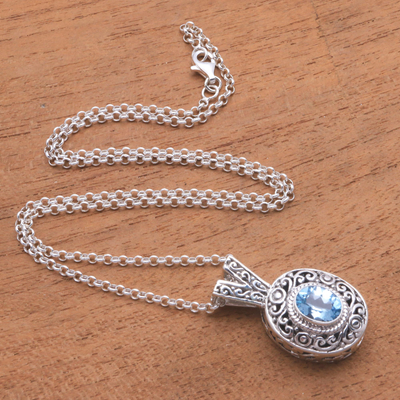 Blue topaz pendant necklace, 'Angel Eye' - Swirl Pattern Blue Topaz Pendant Necklace from Bali