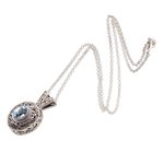 Blue topaz pendant necklace, 'Angel Eye' - Swirl Pattern Blue Topaz Pendant Necklace from Bali