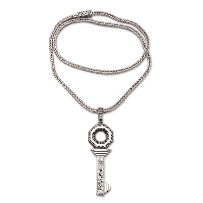 Sterling silver pendant necklace, 'Buddha's Curl Key' - Sterling Silver Key Pendant Necklace from Bali