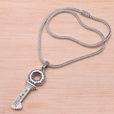 Sterling silver pendant necklace, 'Buddha's Curl Key' - Sterling Silver Key Pendant Necklace from Bali