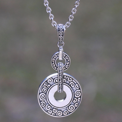 Sterling silver pendant necklace, 'Buddha Symphony' - Circular Buddha's Curl Sterling Silver Pendant Necklace