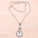 Sterling silver pendant necklace, 'Buddha Symphony' - Circular Buddha's Curl Sterling Silver Pendant Necklace