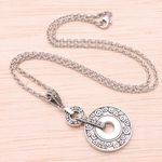 Sterling silver pendant necklace, 'Buddha Symphony' - Circular Buddha's Curl Sterling Silver Pendant Necklace
