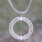 Reversible garnet and cultured pearl pendant necklace, 'Faces of Buddha' - Garnet and Cultured Pearl Reversible Pendant Necklace