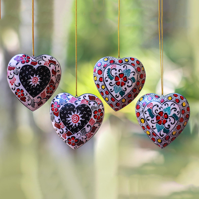 Batik wood ornaments, 'Heart Flowers' (set of 4) - Floral Batik Wood Heart Ornaments from Java (Set of 4)