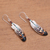 Bone and amethyst dangle earrings, 'Antique Feathers' - Hand-Painted Bone and Amethyst Feather Dangle Earrings