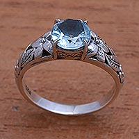 Blue topaz single-stone ring, 'Floral Glint'