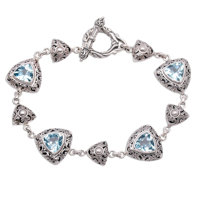 Blue topaz link bracelet, 'Triangles of Swirls' - Triangular Blue Topaz Link Bracelet from Bali