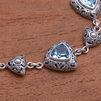Blue topaz link bracelet, 'Triangles of Swirls' - Triangular Blue Topaz Link Bracelet from Bali