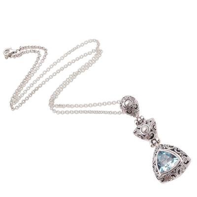 Blue topaz pendant necklace, 'Triangle of Swirls' - Triangular Blue Topaz Pendant Necklace from Bali