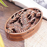 Wood puzzle box, 'Dragon Oval' - Dragon-Themed Suar Wood Puzzle Box from Bali