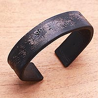 Leather cuff bracelet, 'Hidden Stars in Black' - Subtle Star Motif Black Leather Cuff Bracelet from Bali