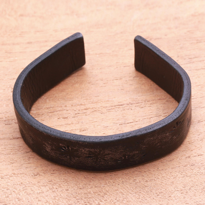 Leather cuff bracelet, 'Hidden Stars in Black' - Subtle Star Motif Black Leather Cuff Bracelet from Bali