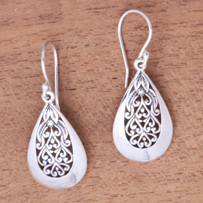 Sterling silver dangle earrings, 'Hidden Flower' - Drop-Shaped Floral Sterling Silver Dangle Earrings from Bali