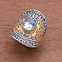 Gold accented blue topaz single-stone ring, 'Powerful Gemstone'