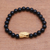Gold accented onyx beaded stretch bracelet, 'Fierce Snake' - Gold Accented Snake-Themed Onyx Beaded Stretch Bracelet