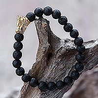 Gold accented lava stone beaded stretch bracelet, 'Calm Dragon'