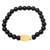 Gold accented onyx beaded stretch bracelet, 'Bear's Strength - Gold Accented Bear-Themed Onyx Beaded Stretch Bracelet