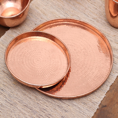Copper trays, 'Gleaming Circles' (pair) - Handcrafted Circular Copper Trays from Bali (Pair)