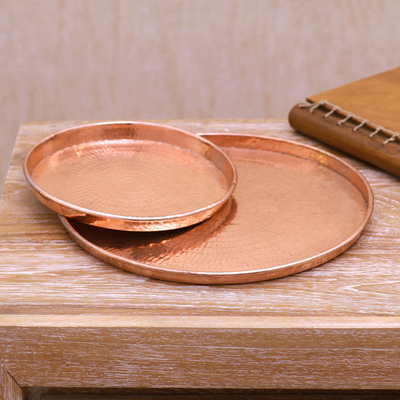 Copper trays, 'Gleaming Circles' (pair) - Handcrafted Circular Copper Trays from Bali (Pair)