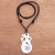 Bone and garnet pendant necklace, 'Celtic Sea Serpent' - Swirl Pattern Pendant Necklace from Bali