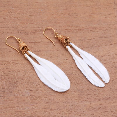 Gold accented bone dangle earrings, 'Feather Twins' - Wing-Themed Gold Accented Bone Dangle Earrings