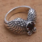Garnet cocktail ring, 'Winged Glitter' - Wing Motif Garnet Band Ring from Bali