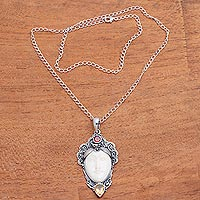 Garnet pendant necklace, 'Glittering Wing' - Wing-Shaped Garnet Pendant Necklace from Bali