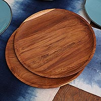 Teak wood plates, 'Nature's Course' (14 inch, pair) - Handmade Natural Teak Wood Plates from Bali (14 Ine, Pair)