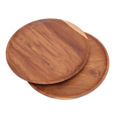 Teak wood plates, 'Nature's Course' (14 inch, pair) - Handmade Natural Teak Wood Plates from Bali (14 Ine, Pair)