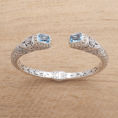 Gold accented blue topaz cuff bracelet, 'Leafy Oceans' - Gold Accented Leaf Pattern Blue Topaz Cuff Bracelet
