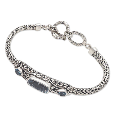 Blue topaz pendant bracelet, 'Splendid Bali' - Faceted Blue Topaz Pendant Bracelet from Bali