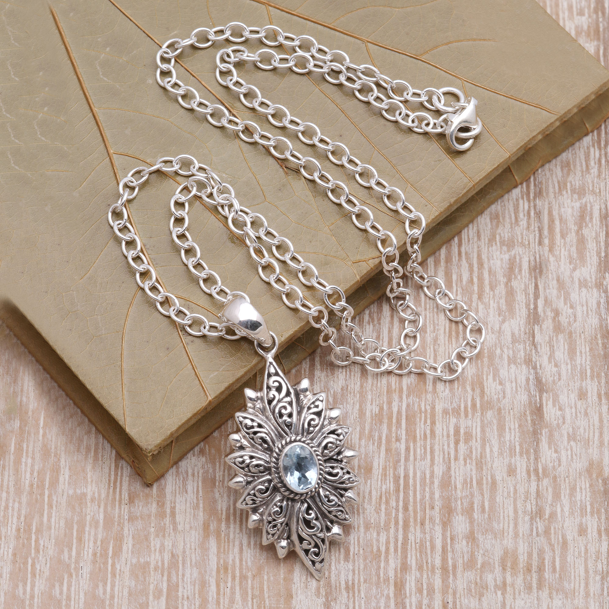 Swirl Pattern Blue Topaz Pendant Necklace Crafted in Bali, 'Glittering  Snowflake'