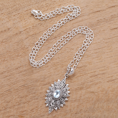 Blue topaz pendant necklace, 'Glittering Snowflake' - Swirl Pattern Blue Topaz Pendant Necklace Crafted in Bali