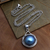 Halskette mit Zuchtperlen-Anhänger, 'Mondnest'. - Blaue Zuchtperlenkette mit Mabe und Rolo-Kette